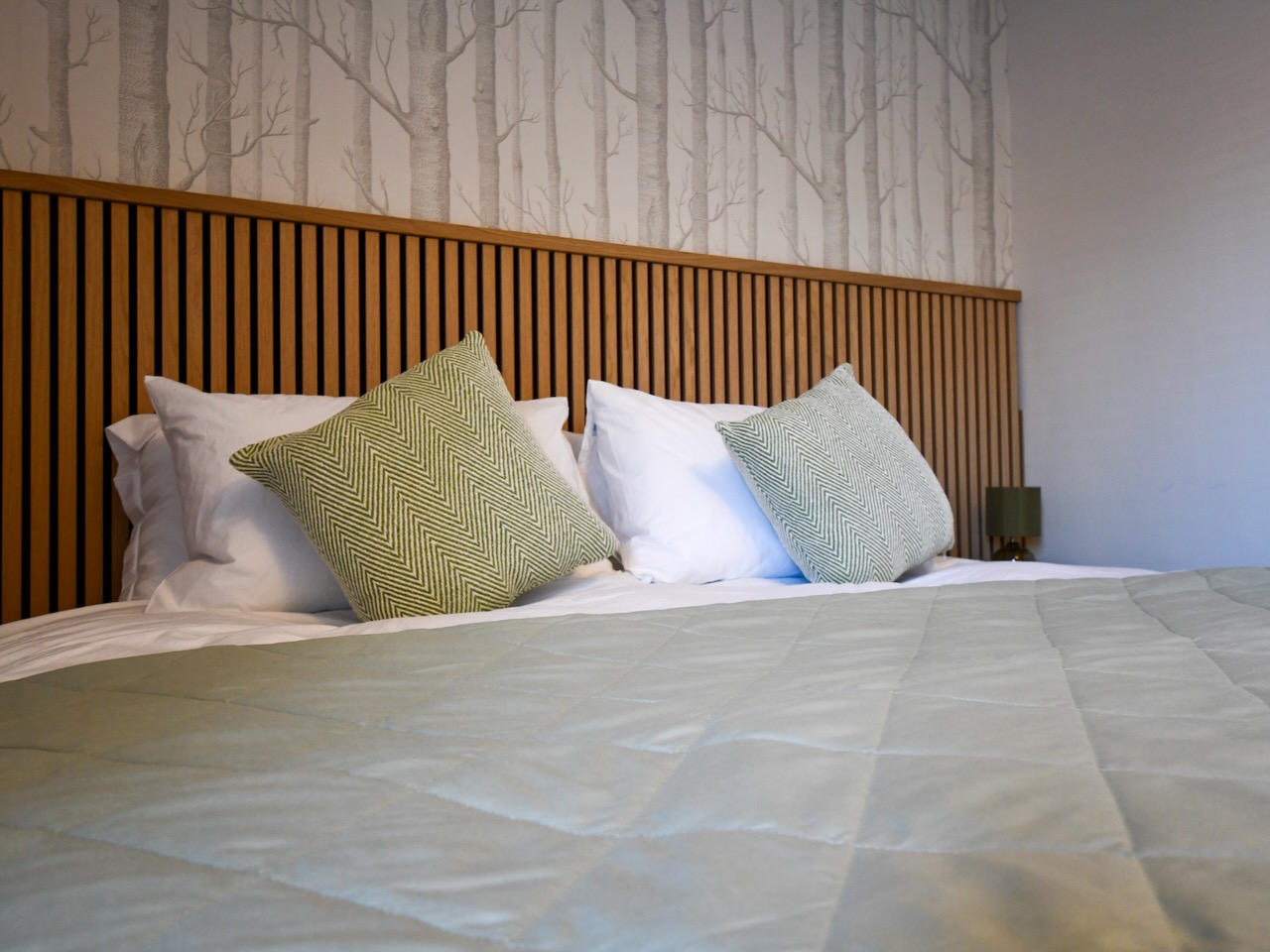 Close up of bed in room 2 made up as superking