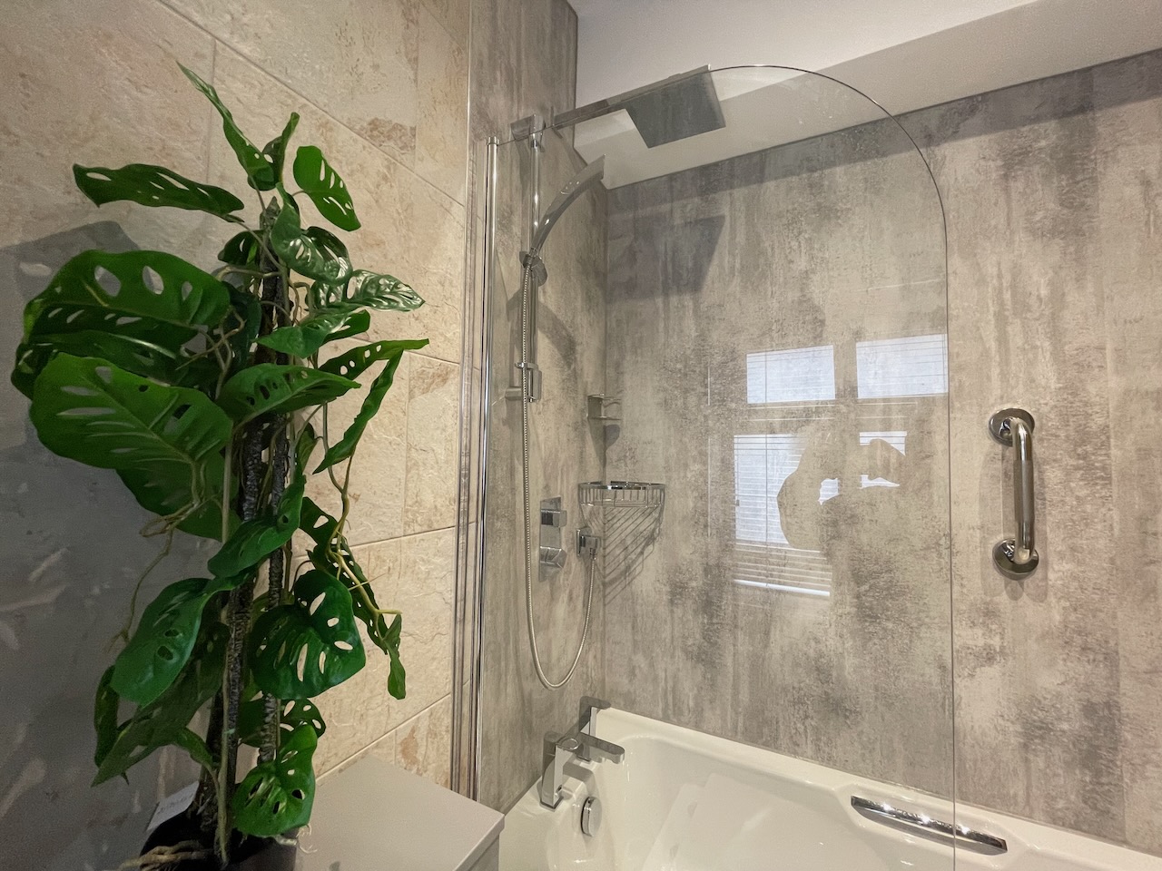 Over bath shower in downstairs bathroom